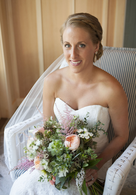 A bride with her bouquet on her wedding day in Bar Harbor