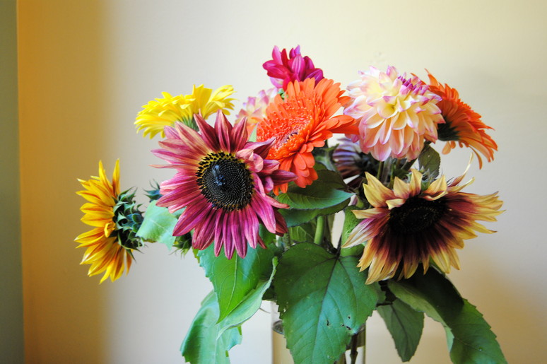 A bright arrangement built around sunflowers