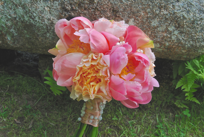 A soft bouquet of pink garden peonies